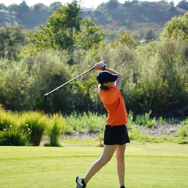 Lady golfer swinging a golf club