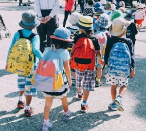 school children walking with school bags
