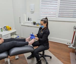 Adelaide Podiatrist Tessa Coleman treating feet