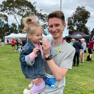Adelaide Podiatrist, Tom Kolesnik standing with daughter after Adelaide Marathon 2023