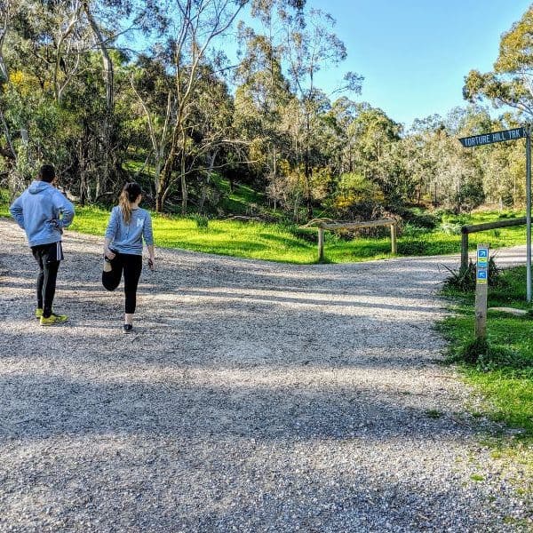 Two people hiking Ansteys Hill in Adelaide, South Australia