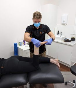 Adelaide Podiatrist, Will Duncan, assessing joint range of motion prior to orthotic therapy