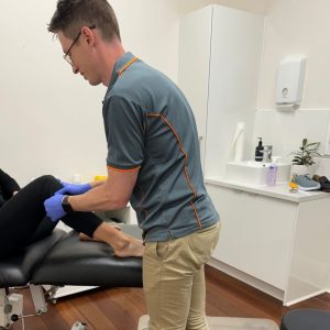 Adelaide Podiatrist, Tom Kolesnik, using fibula head mobilisation for lower leg pain