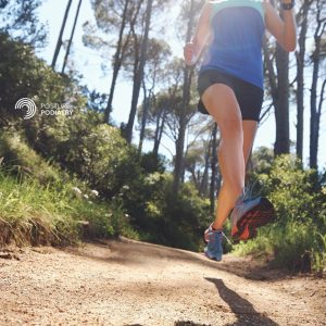 A runner trail running downhill